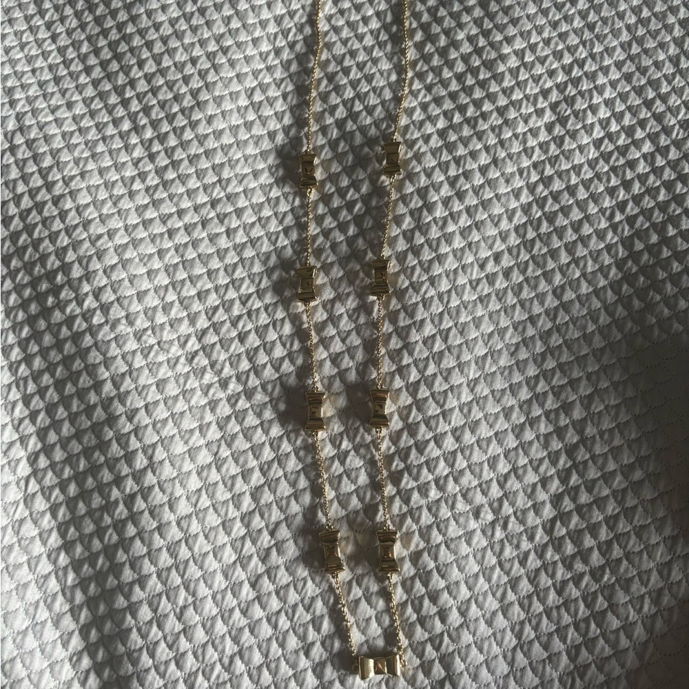 KATE SPADE Gold Tone Gold Enamel Bow Long Necklace